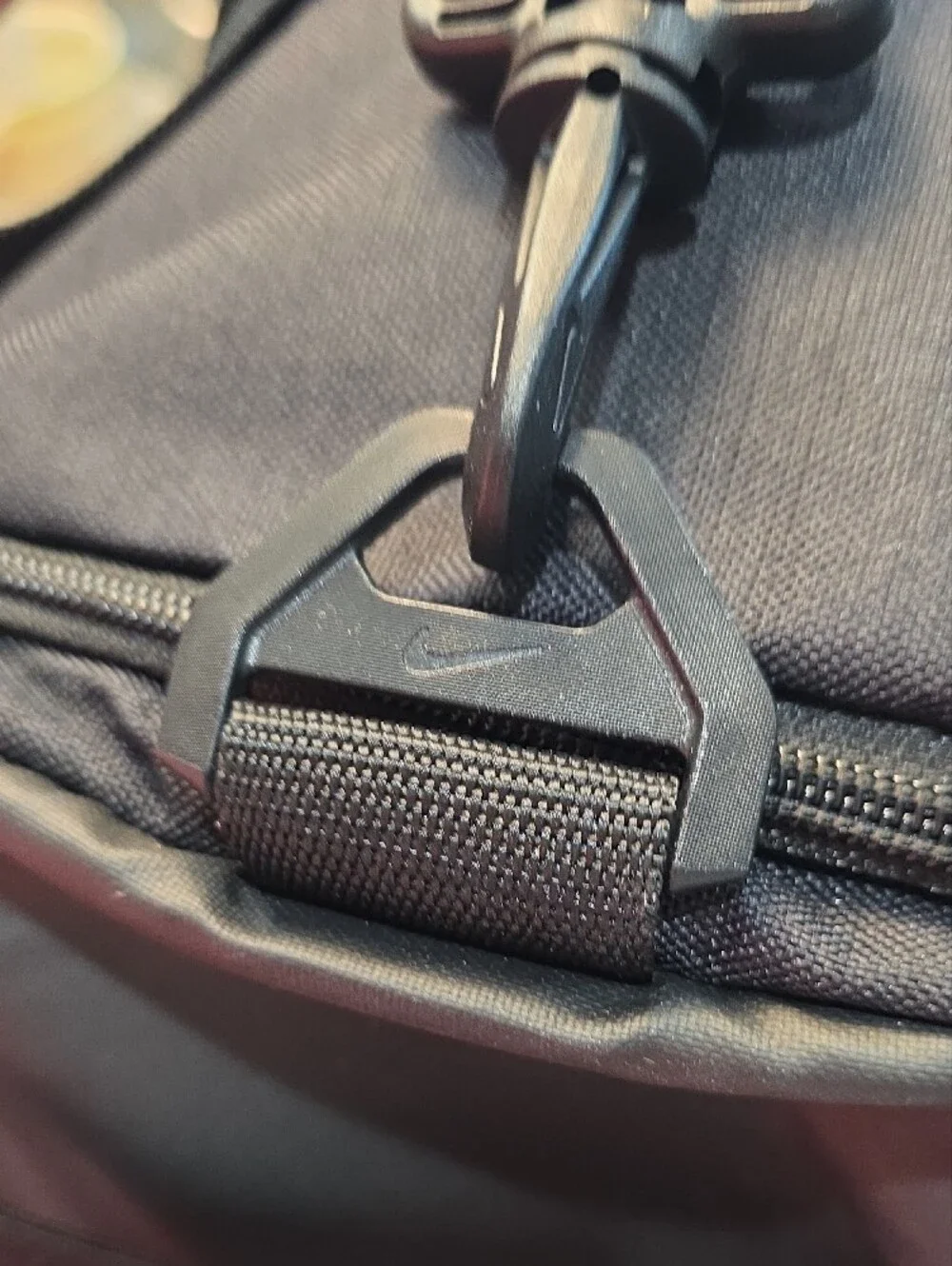 Nike Black Duffel Bag with White Swoosh and Branded Strap